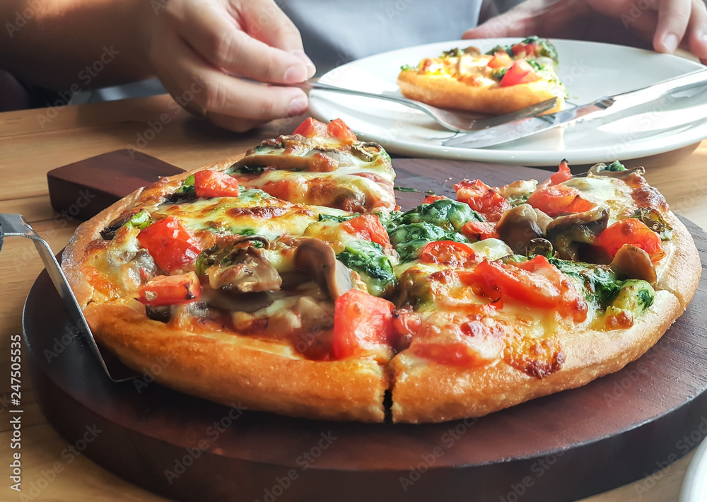 vegetarian pizza with peppers, mushrooms, tomatoes