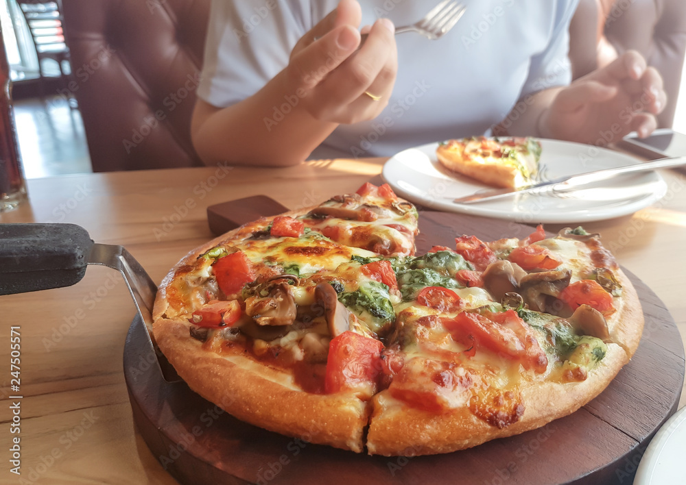vegetarian pizza with peppers, mushrooms, tomatoes