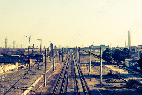 Railway lines. Road to infinity. Rails going far to horizon. Old railroad in an industrial town. photo