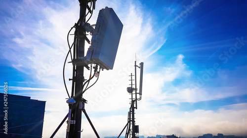 Silhouette of 5G smart cellular network antenna base station on the telecommunication mast
