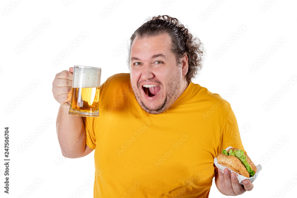 Funny fat man eating burger and drinking alcohol beverage on white background Funny fat man eating burger and drinking alcohol beverage on white background