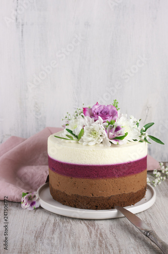 Fresh flowers decorated layered cake