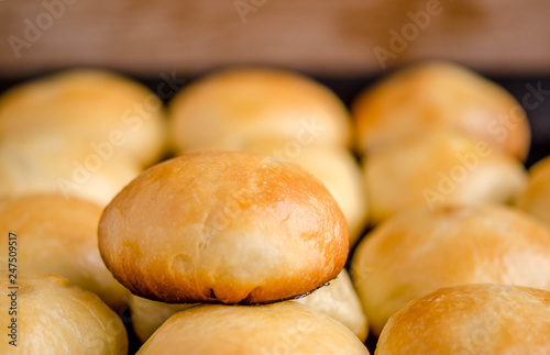 Potato pies on a baking sheet