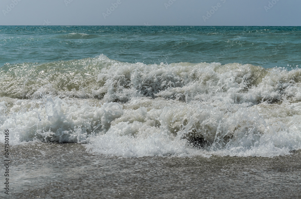 Fototapeta premium Sea waves on a sandy beach
