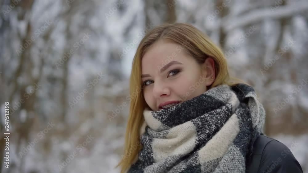 alluring young pretty woman is walking outdoors in winter day, looking at camera playfully, enjoying alluring young pretty woman is walking outdoors in winter day, looking at camera playfully, enjoying