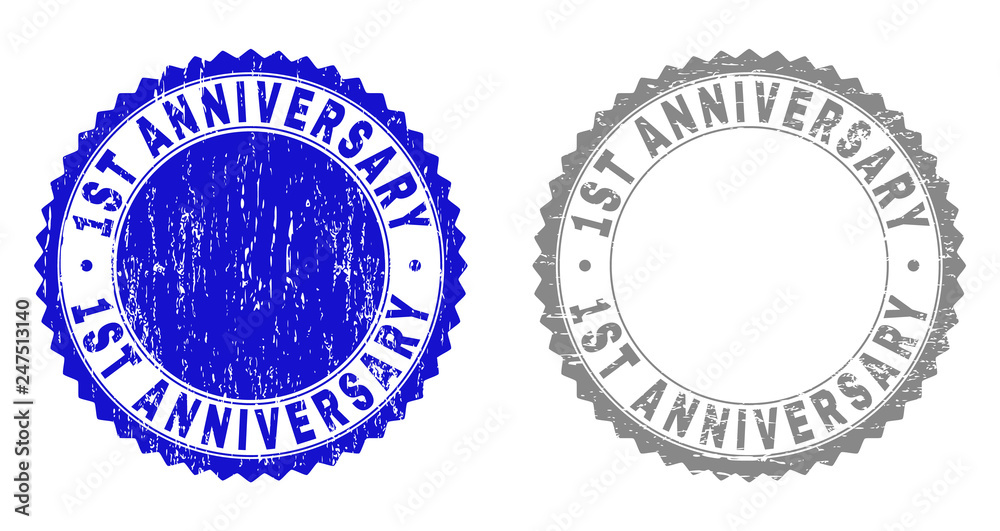 1ST ANNIVERSARY stamp seals with grunge texture in blue and grey colors isolated on white background. Vector rubber imitation of 1ST ANNIVERSARY title inside round rosette.