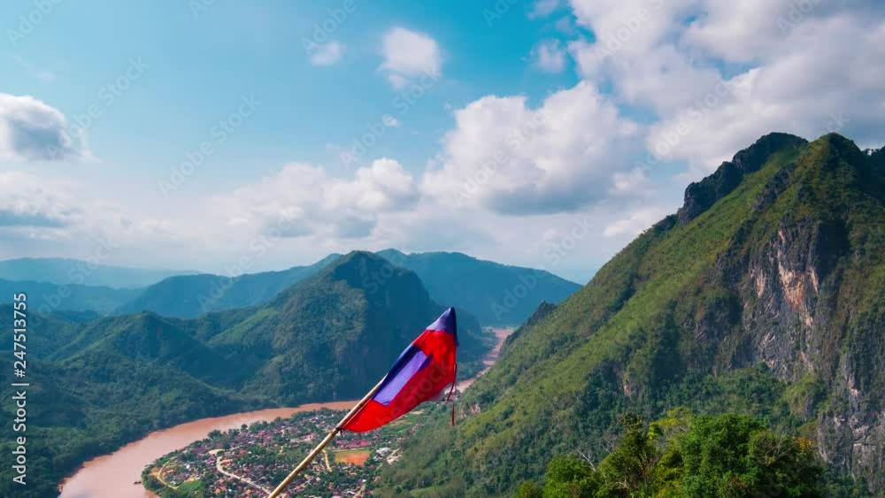 Time lapse: Laos landscape motion clouds Nong Khiaw from the Pha Daeng mountain top national flag, dramatic sky, scenic mountains and limestone pinnacle, famous travel destination in South East Asia Time lapse: Laos landscape motion clouds Nong Khiaw from the Pha Daeng mountain top national flag, dramatic sky, scenic mountains and limestone pinnacle, famous travel destination in South East Asia