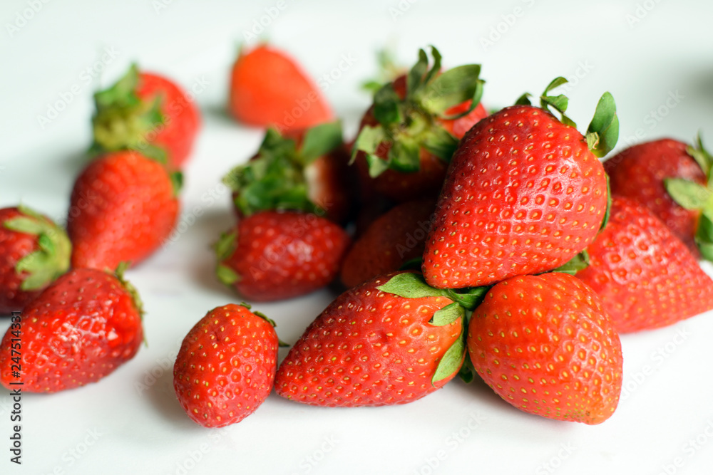 Fresh strawberries on on white background. Village strawberry close up. Fresh strawberries on on white background. Village strawberry close up.