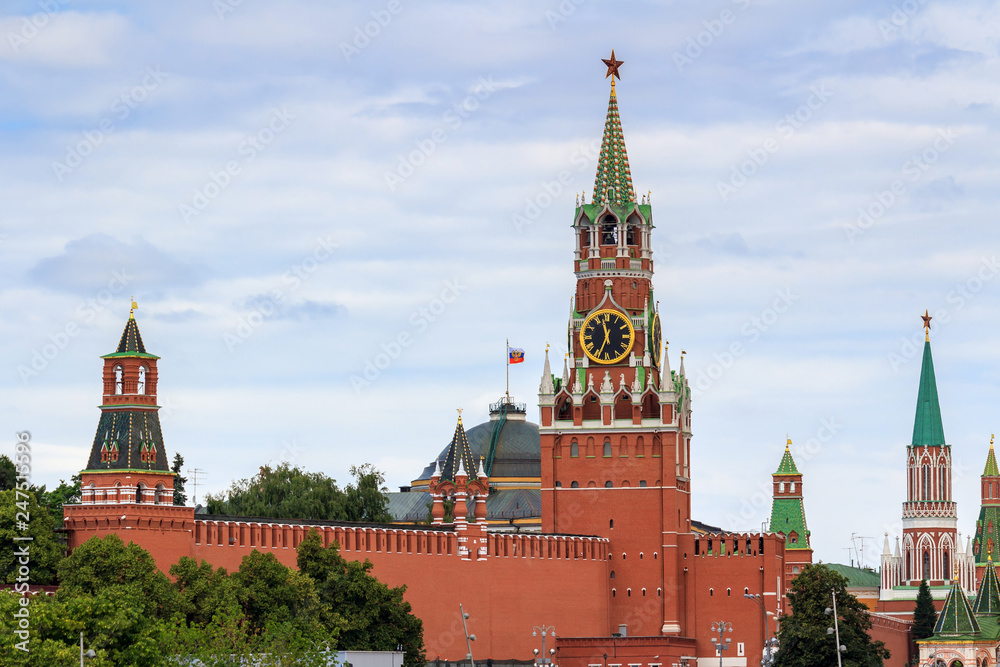 Moscow Kremlin towers on a background of cloudy sky Moscow Kremlin towers on a background of cloudy sky