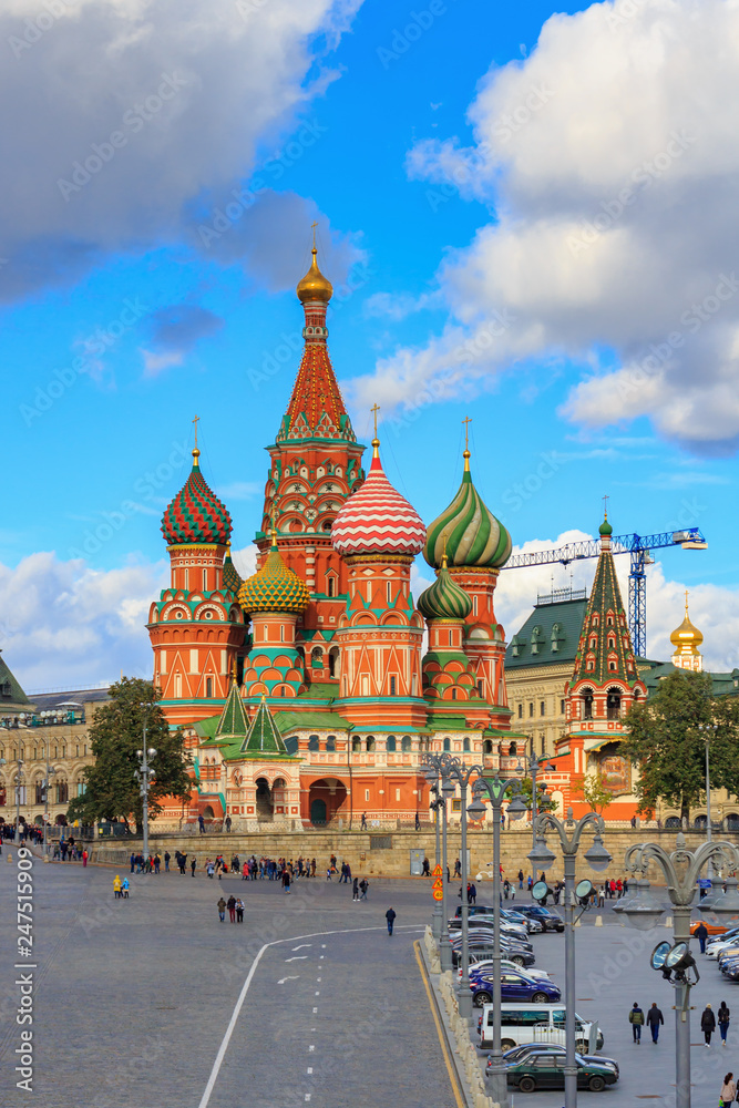 View of St. Basil's Cathedral on Red Square against blue sky with clouds in sunny day