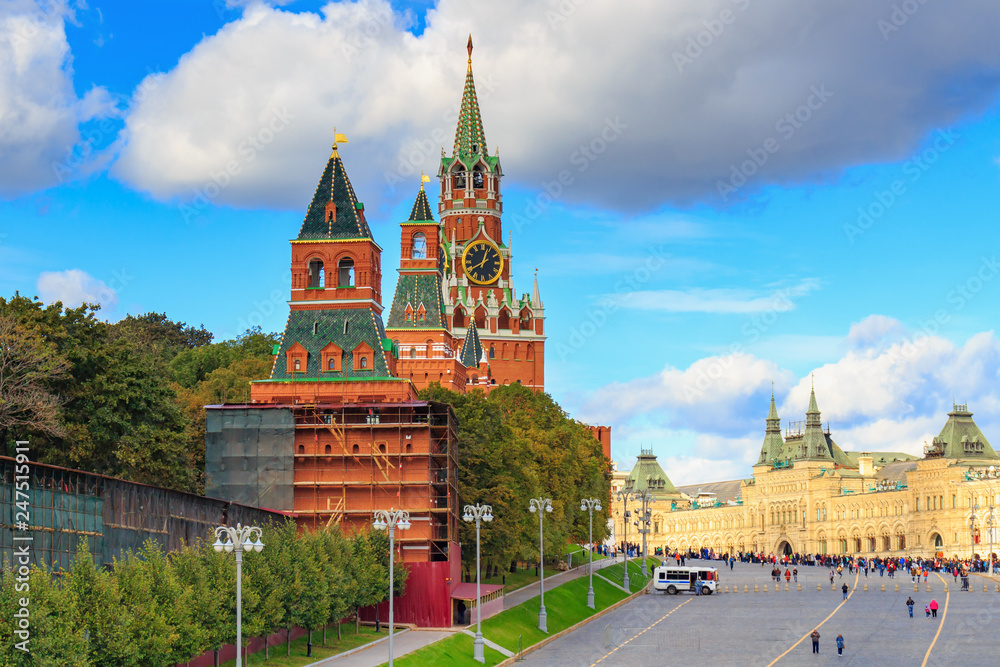 View of Moscow Kremlin towers and Red square in sunny day against blue sky with white clouds View of Moscow Kremlin towers and Red square in sunny day against blue sky with white clouds