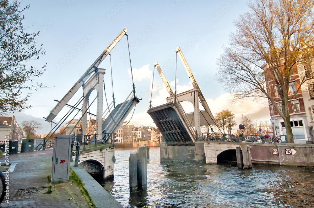 Drawbridge is opening in the centre of Amsterdam,  Netherlands.