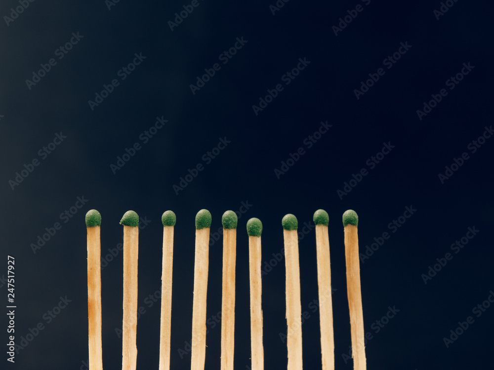 sulfur matches are burning on a black background sulfur matches are burning on a black background