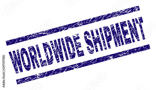 WORLDWIDE SHIPMENT seal print with grunge style. Blue vector rubber print of WORLDWIDE SHIPMENT text with dust texture. Text tag is placed between parallel lines.