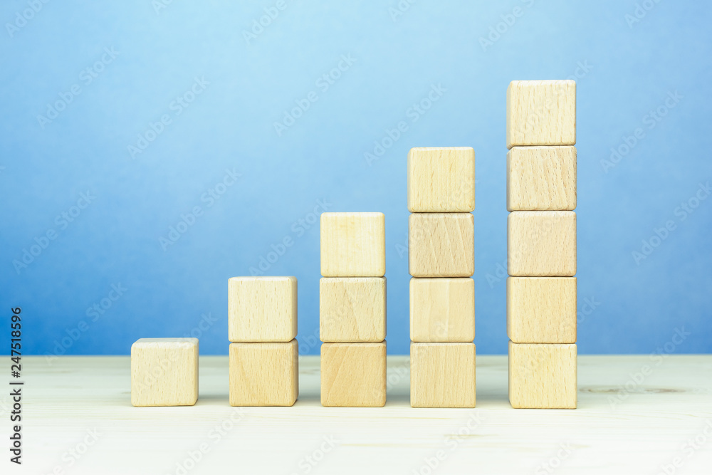 Business for growth, strategy and success plan concept with wooden blocks stacking as step stair on table Business for growth, strategy and success plan concept with wooden blocks stacking as step stair on table
