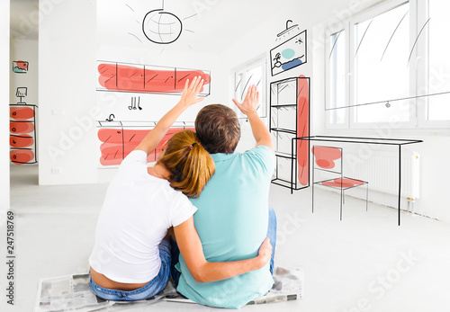 Couple planning furniture at their new empty apartment. Living coral and limpet shell colors.