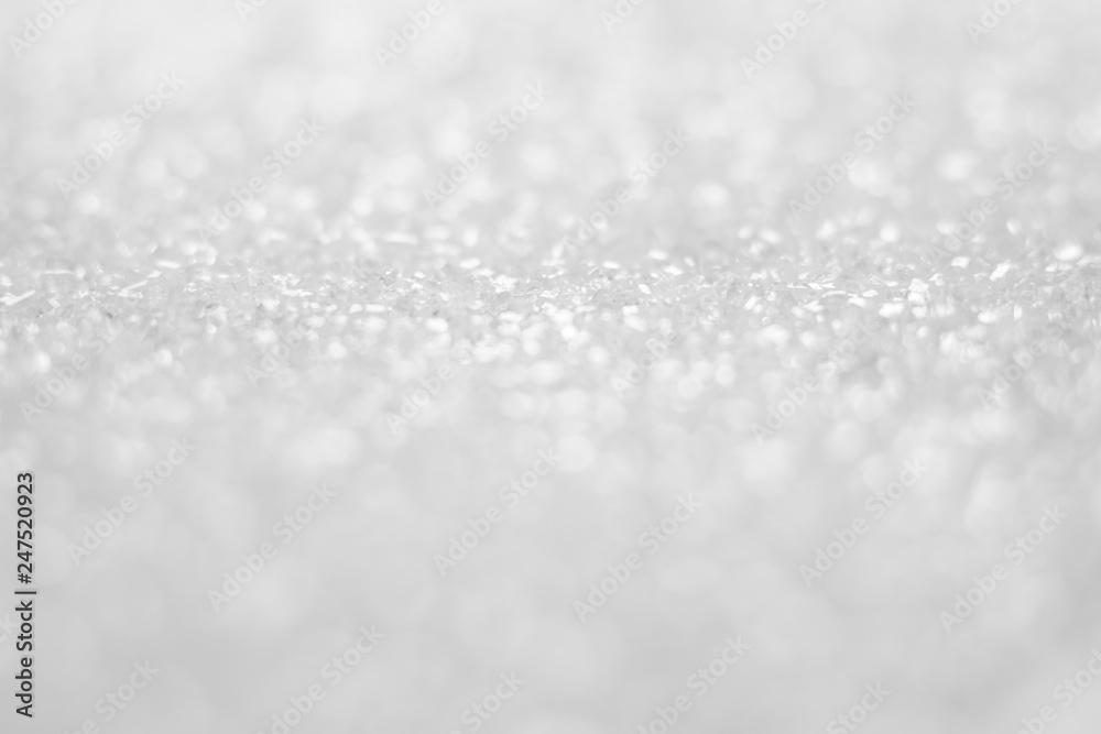 White blurry bokeh glitter abstract background. White blurry bokeh glitter abstract background.