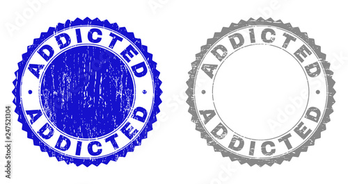 ADDICTED stamp seals with grunge texture in blue and grey colors isolated on white background. Vector rubber imitation of ADDICTED tag inside round rosette. Stamp seals with grunge textures.
