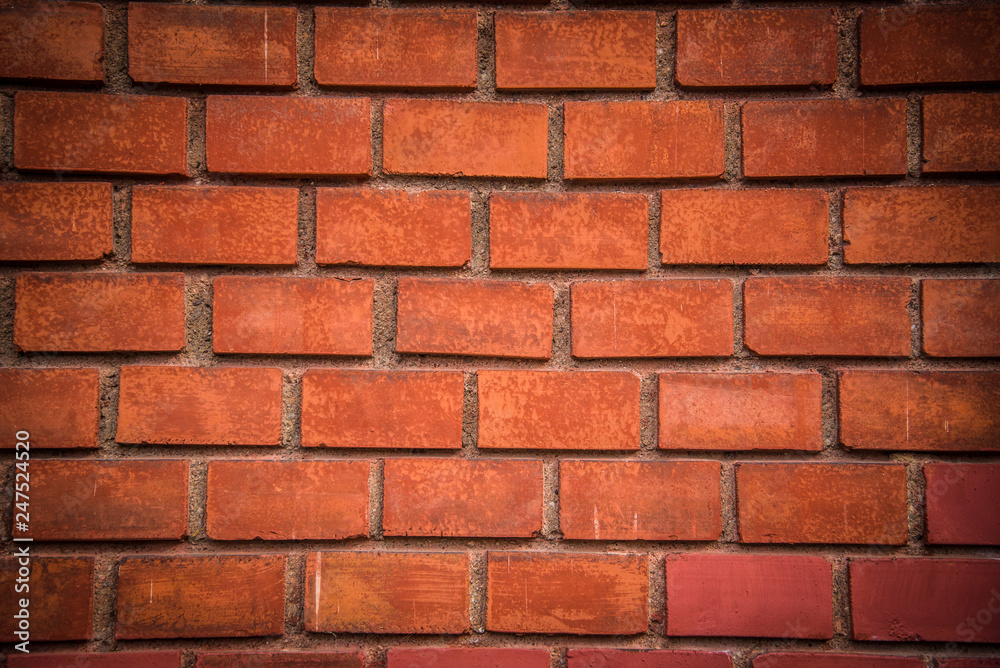 Fototapeta premium Szczegół tło z czerwonej cegły ściany z ciemnej winiety w rogach