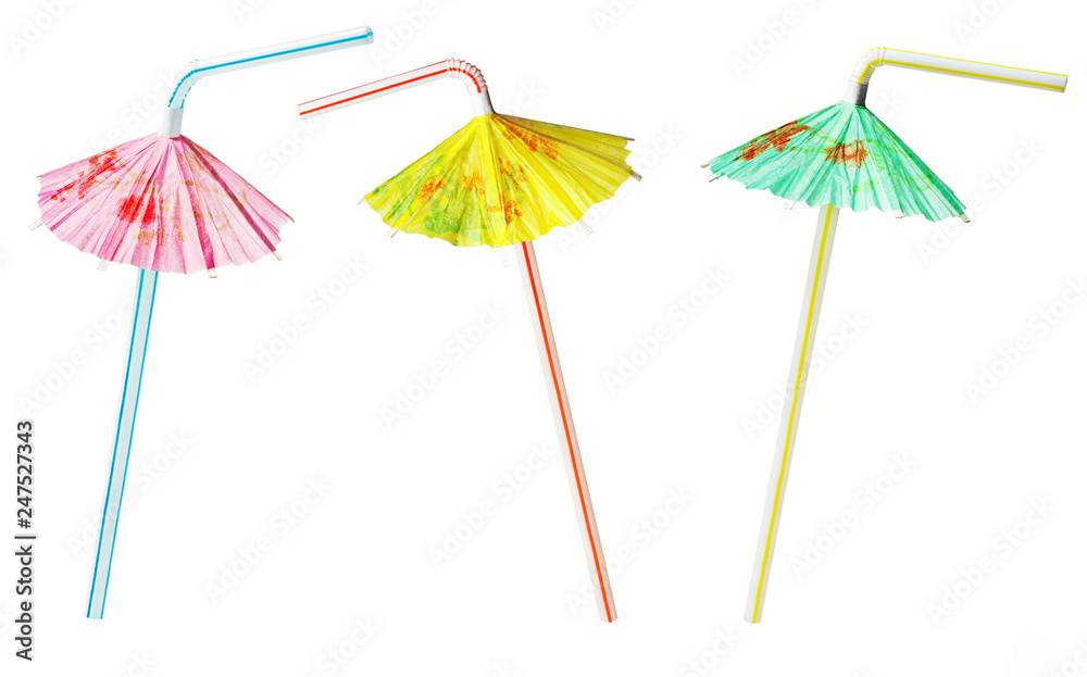 Multicolor cocktail tubes with umbrellas, isolated on white background