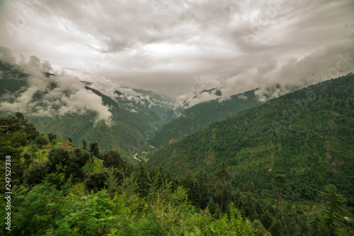 mountain range view. Timelapse Of Moving Clouds And Fog over Himalayan mountain range in Sainj