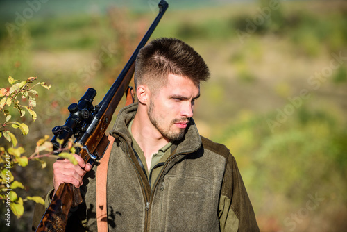 Hunting skills and weapon equipment. How turn hunting into hobby. Bearded man hunter. Army forces. Camouflage. Military uniform fashion. Man hunter with rifle gun. Boot camp. confident look