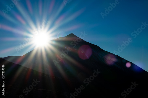 Star sun behind high Teide volcano in Tenerife