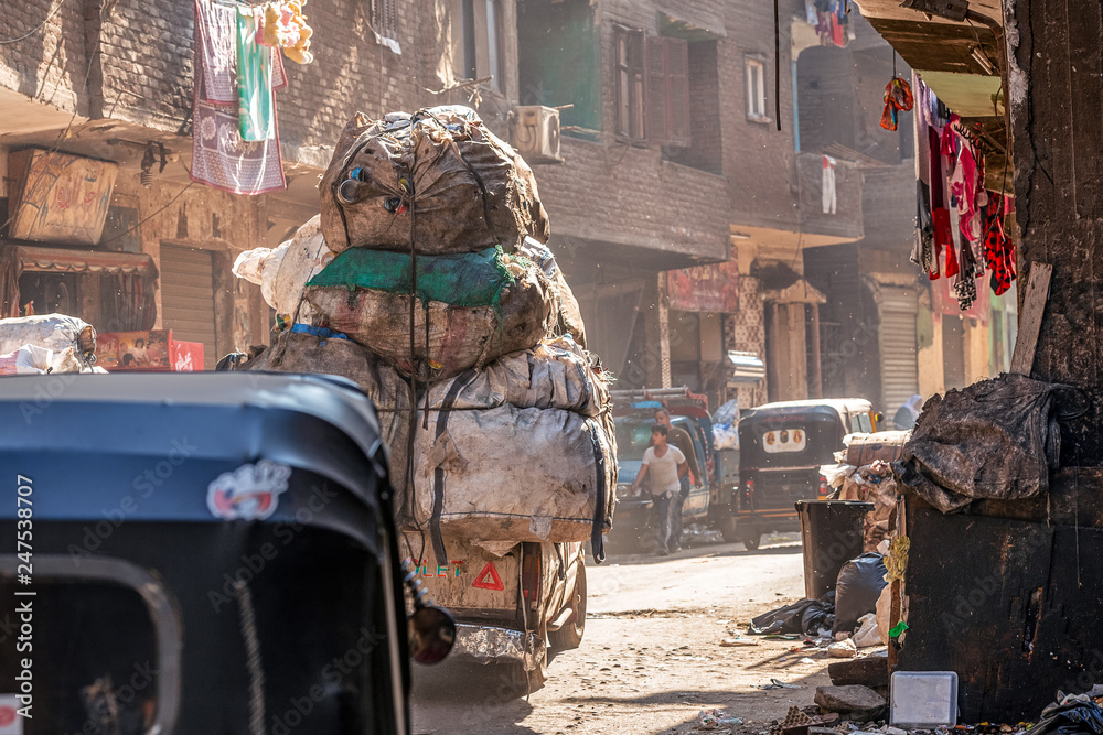 18/11/2018 Cairo, Egypt, transportation on the street of garbage town among a bunch of rubbish and unacceptable stench on a sunny day
