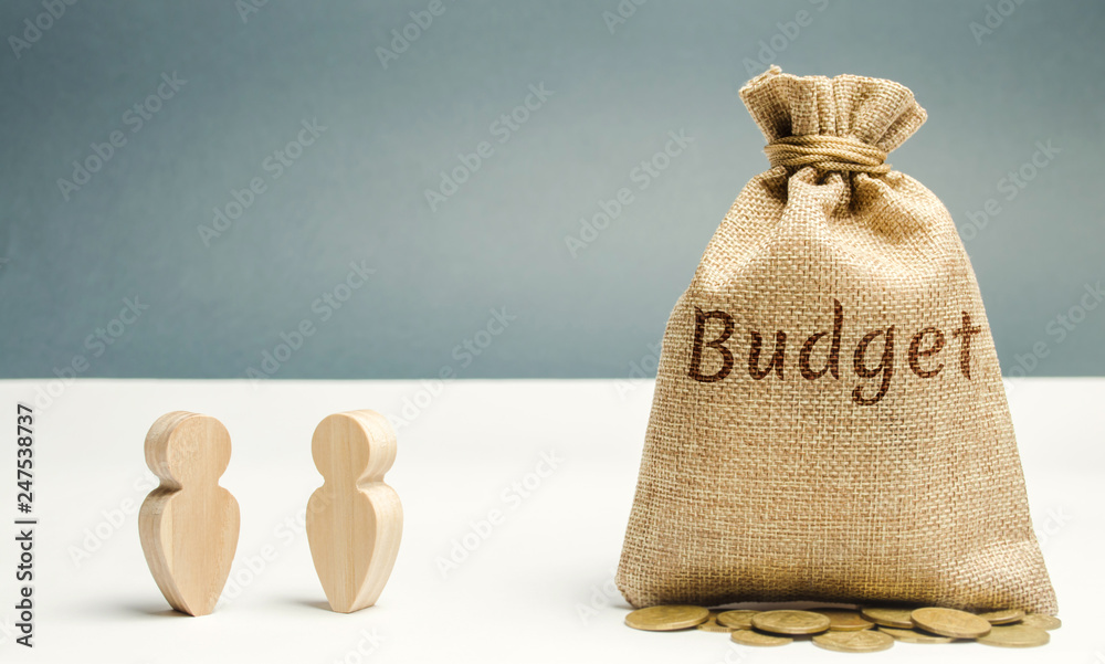 Two businessmen are discussing the company's budget. Business planning. The distribution of costs and resources. Profit taking. Search for sources of funding. Revenue analysis. Financial strategy Two businessmen are discussing the company's budget. Business planning. The distribution of costs and resources. Profit taking. Search for sources of funding. Revenue analysis. Financial strategy