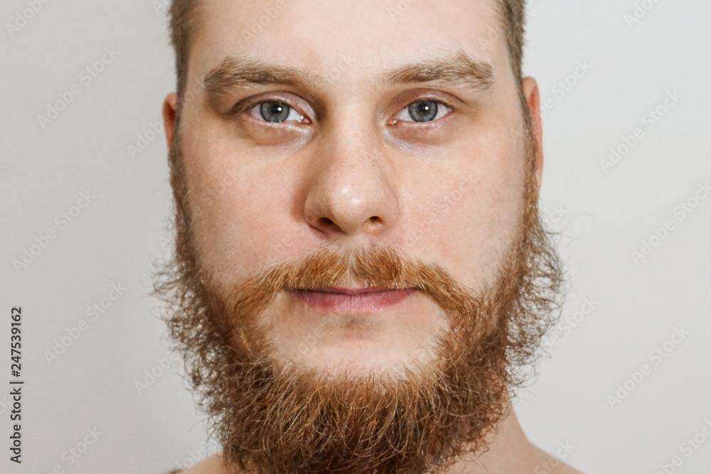 close-up portrait serious calm bearded not trimmed guy in the background close-up portrait serious calm bearded not trimmed guy in the background