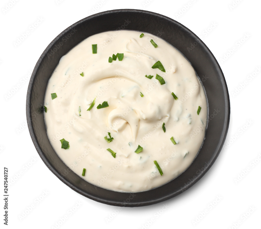 garlic sauce in black bowl isolated on white background. top view garlic sauce in black bowl isolated on white background. top view