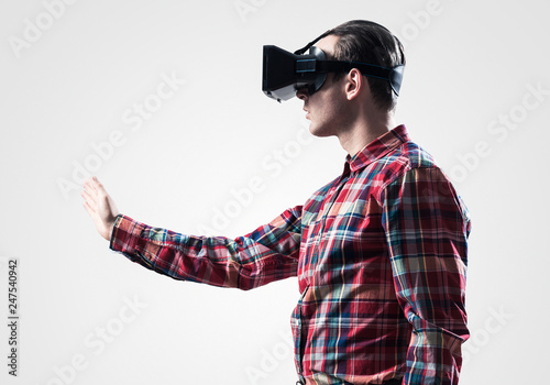Guy in mask experiencing virtual reality as new entertainment device