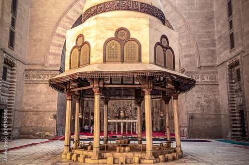 .18/11/2018 Cairo, Egypt, the interior of the main hall for the prayers of the ancient and largest mosque in Cairo with a well in the center photo