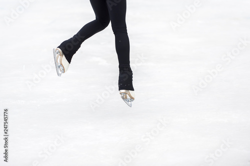 slender legs of girl skate. competitions in figure skating, performance of young athletes