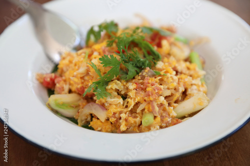 North Thai food Fried fermented sour pork and egg on wooden table