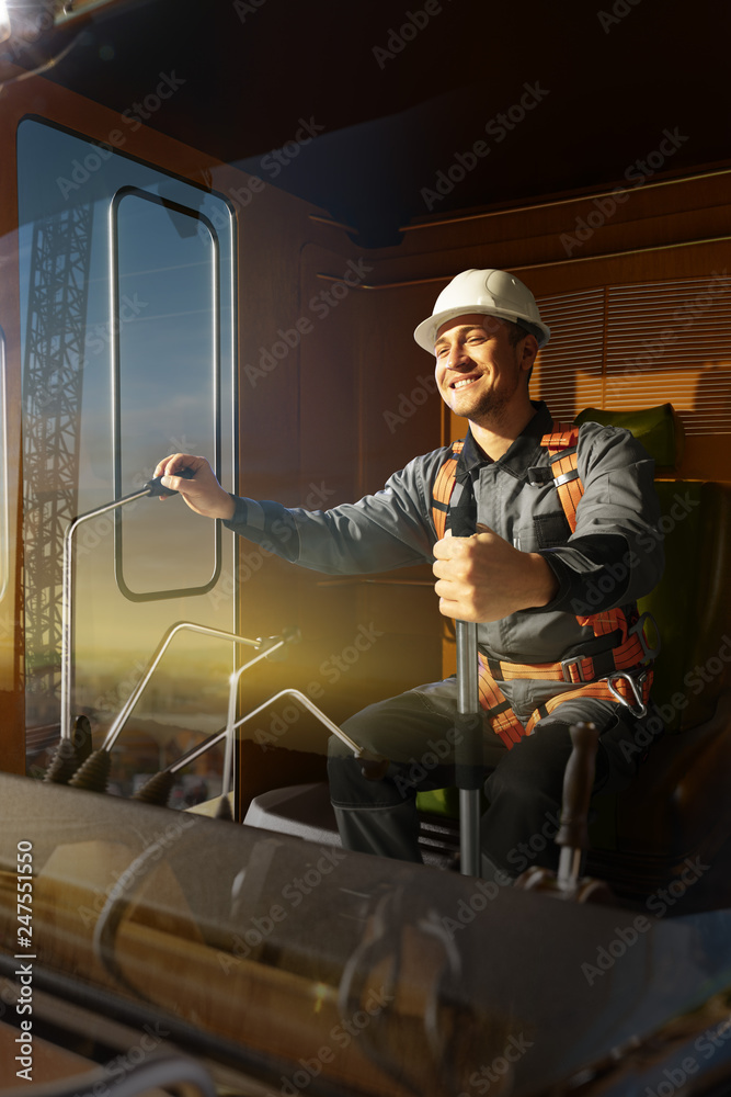 Engineer operator crane in action . He sit a top in crane cabin and working. Around beautiful sunset Engineer operator crane in action . He sit a top in crane cabin and working. Around beautiful sunset