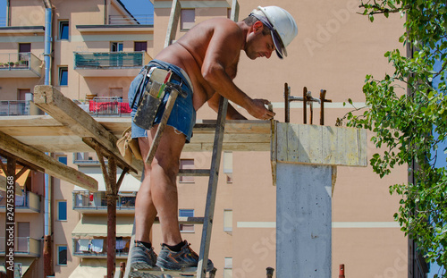 concrete work: workers carpenters preparing construction formwork for concreting at building area