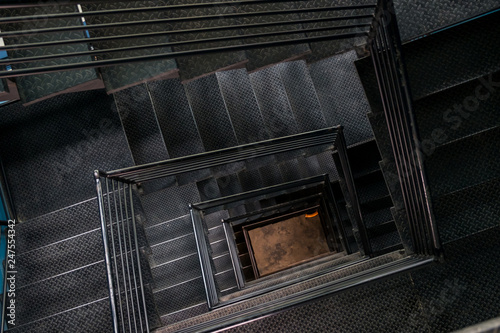 Square steel stairwell view from the top.