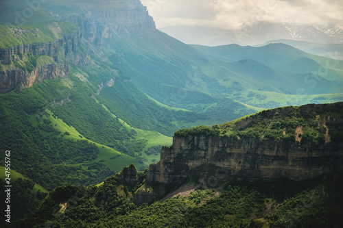 Dramatic landscape of a green valley at the foot of the Inal Plateau in the North Caucasus