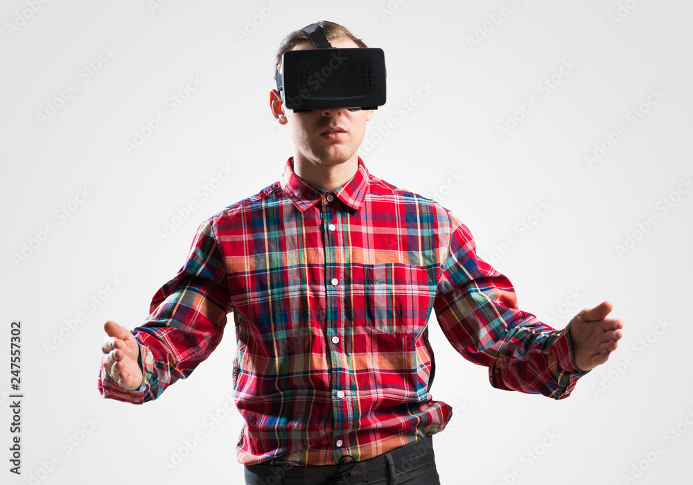 Guy in mask experiencing virtual reality as new entertainment device Guy in mask experiencing virtual reality as new entertainment device
