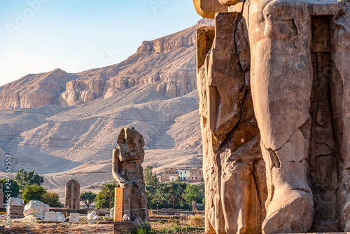 incredibly magnificent and ancient statues of Colossi on the west bank of the Nile. Colossi Memnon in Luxor; luxor; egypr photo