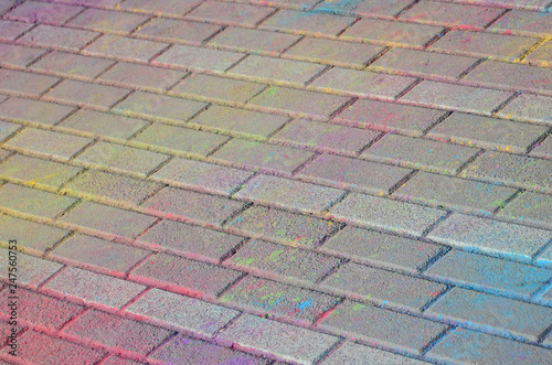 Multi colored paving slabs, powder coated with dry colors at the Holi festival photo