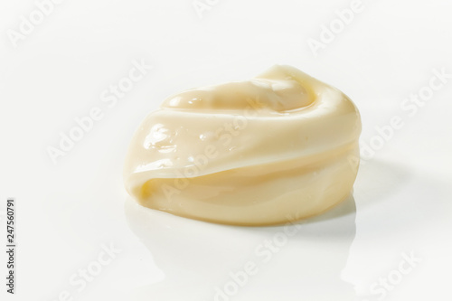 Low angle view of an elegant twist of mayonnaise photo