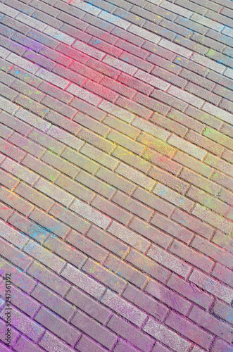 Multi colored paving slabs, powder coated with dry colors at the Holi festival photo