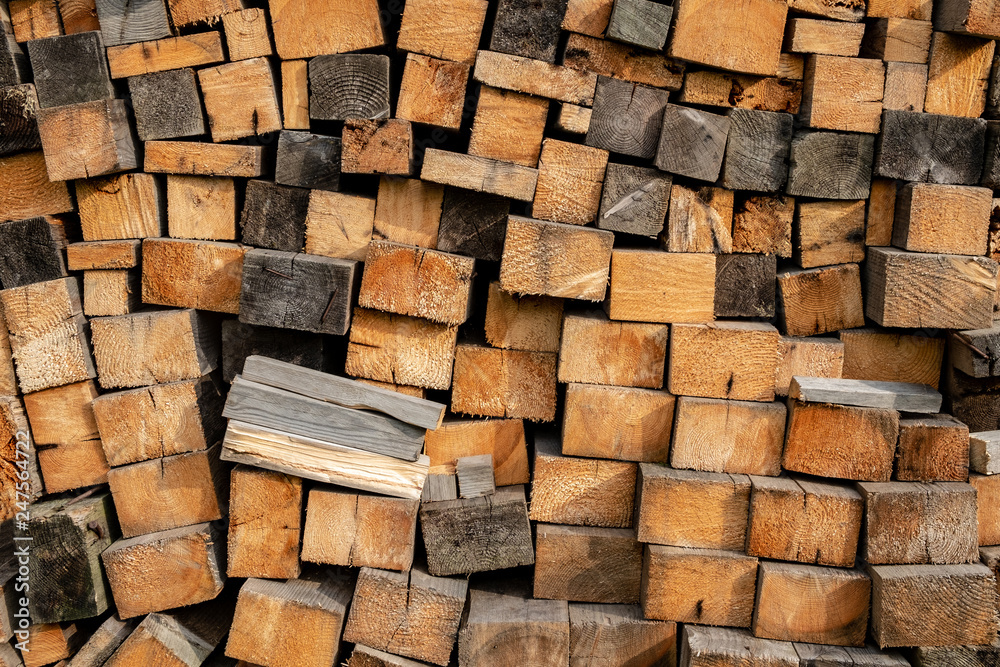 Texture of lumber from wooden rectangles stacked in a pile Texture of lumber from wooden rectangles stacked in a pile