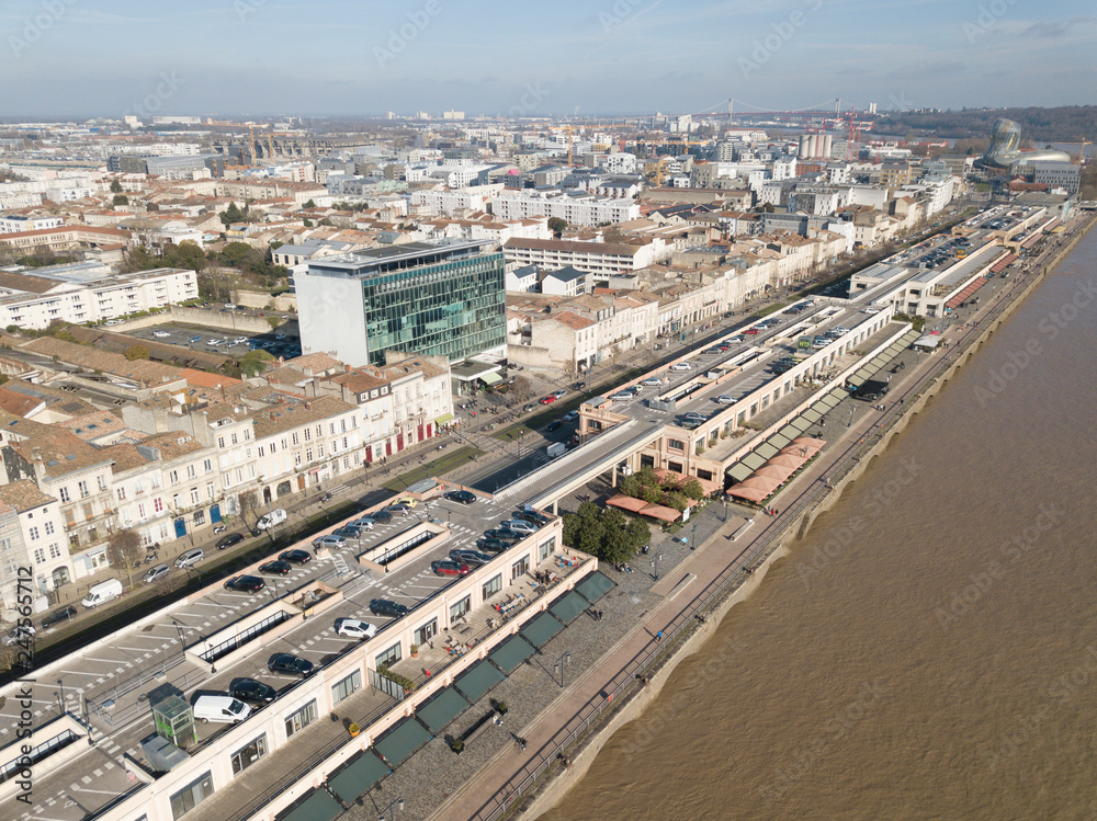 Fototapeta premium Aerial view Quai de Bordeaux, Hangar 14, Congress, Bordeaux and the Garonne river