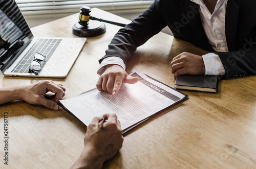 Photos client customer signing contract and discussing business with legal consultants,