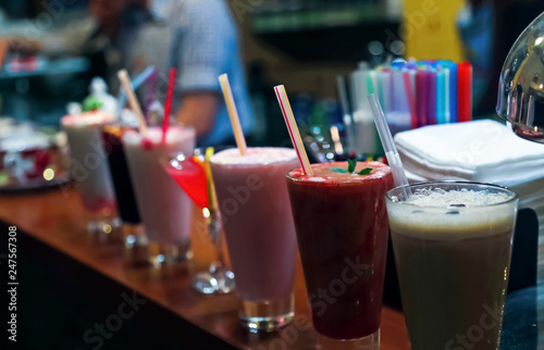 range of different fresh alcohol berry cocktails in a bar