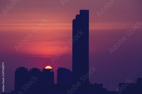 Sky with clouds over the evening city with sunset