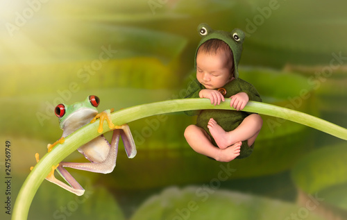 Newborn baby dressed as a frog